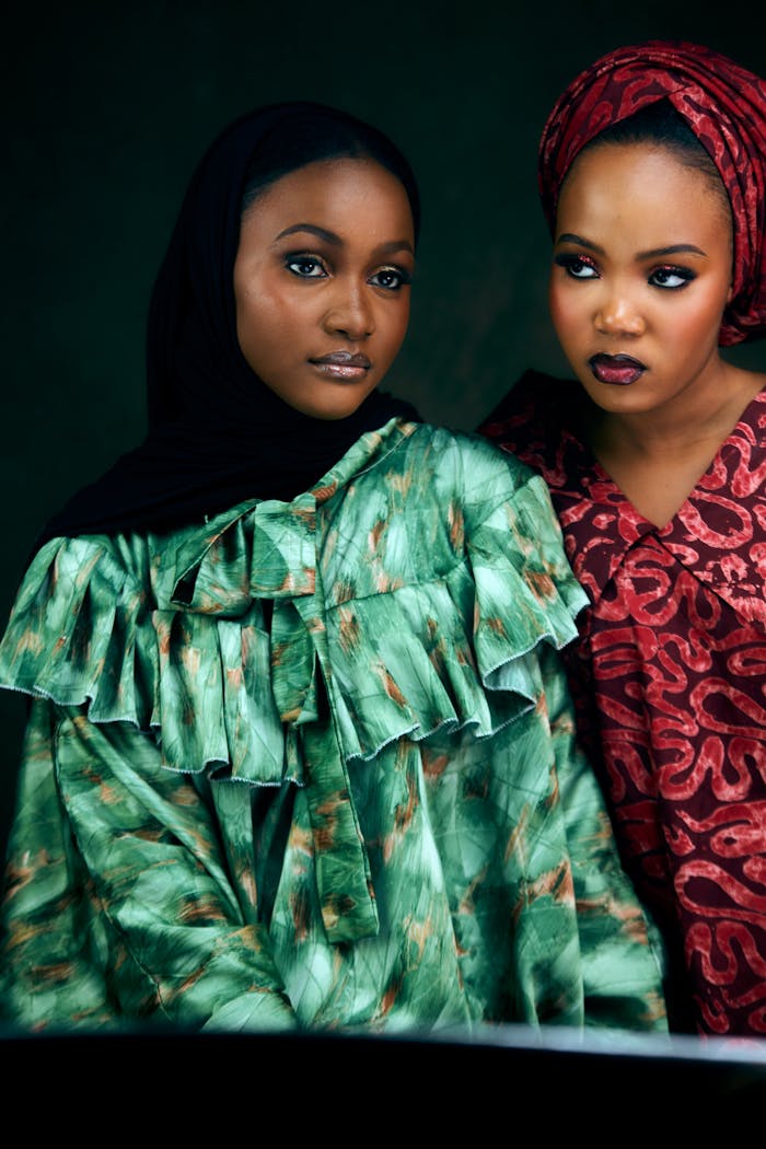 services-04 Elegant portrait of two women in vibrant traditional African clothing.